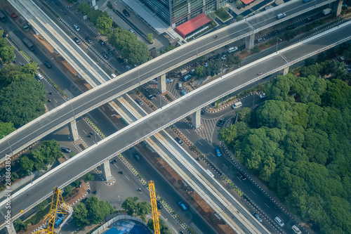 Aerial view of highway road interchange at daytime in the city of Jakarta, Indonesia