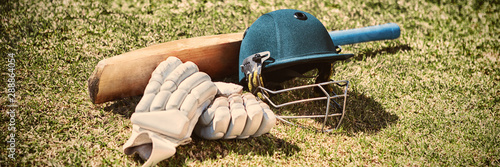 High angle view of cricket equipment on field