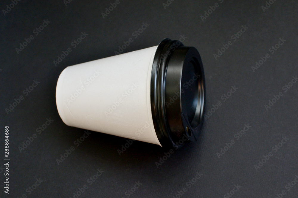 Empty plastic cup on a black background, place for an inscription. Empty plastic cup on a black background, place for an inscription.