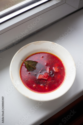 Vegetable soup with beet in plate