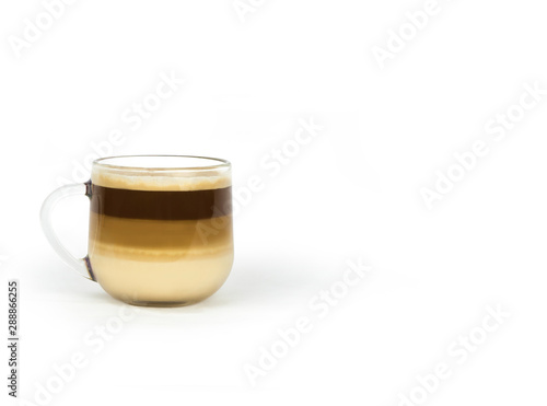 coffee with milk layers in a glass cup on a white background