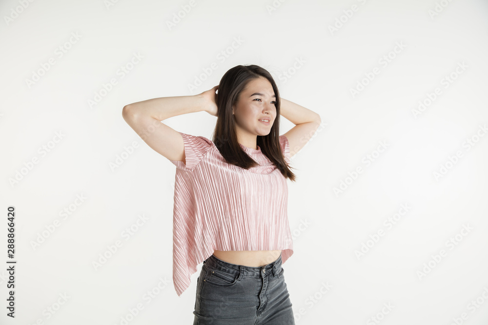 Beautiful female half-length portrait isolated on white studio background. Young emotional woman in casual clothes. Human emotions, facial expression concept. Resting with hands on her head. Relax. Beautiful female half-length portrait isolated on white studio background. Young emotional woman in casual clothes. Human emotions, facial expression concept. Resting with hands on her head. Relax.