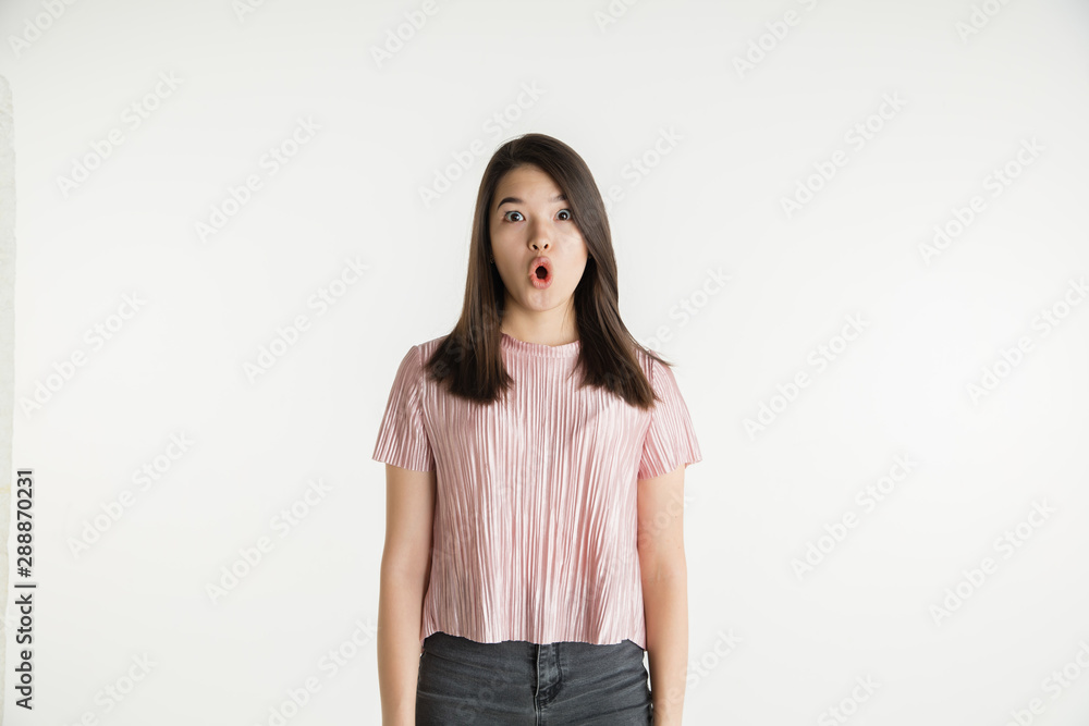 Beautiful female half-length portrait isolated on white studio background. Young emotional woman in casual clothes. Human emotions, facial expression concept. Astonished, shocked, wondered. Beautiful female half-length portrait isolated on white studio background. Young emotional woman in casual clothes. Human emotions, facial expression concept. Astonished, shocked, wondered.