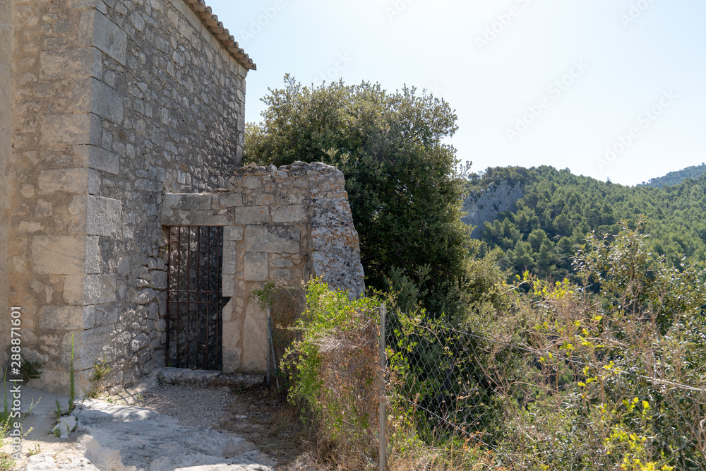 oppède le vieux house street in village perched on cliff in Luberon Provence France