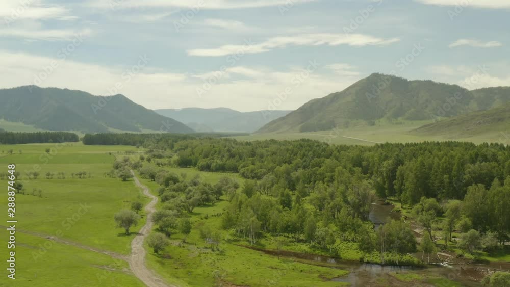 4K resolution, aerial drone at 29 frames per second over mountain in National Park with cloudy skies. Altai. Russia. 4K resolution, aerial drone at 29 frames per second over mountain in National Park with cloudy skies. Altai. Russia.