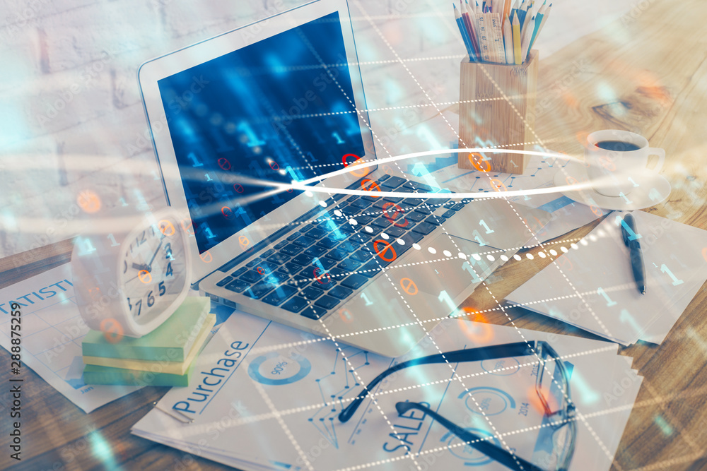 Financial chart drawing and table with computer on background. Multi exposure. Concept of international markets. Financial chart drawing and table with computer on background. Multi exposure. Concept of international markets.