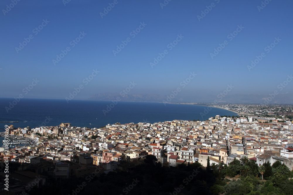 Obraz premium Castellammare del Golfo, Italy - June 29, 2016: overview of the seaside town of Castellammare del Golfo