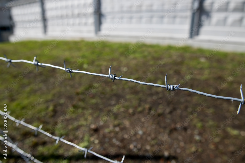 Fence with a barbed wire Fence with a barbed wire