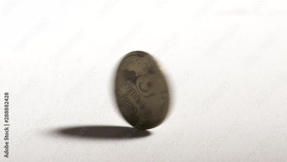 5 Kopeks USSR Russian Soviet coin spinning and dropping on desk. 5 Kopeks USSR Russian Soviet coin spinning and dropping on desk.
