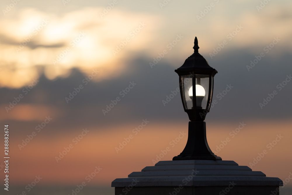 silhouette of street lamp at sunset