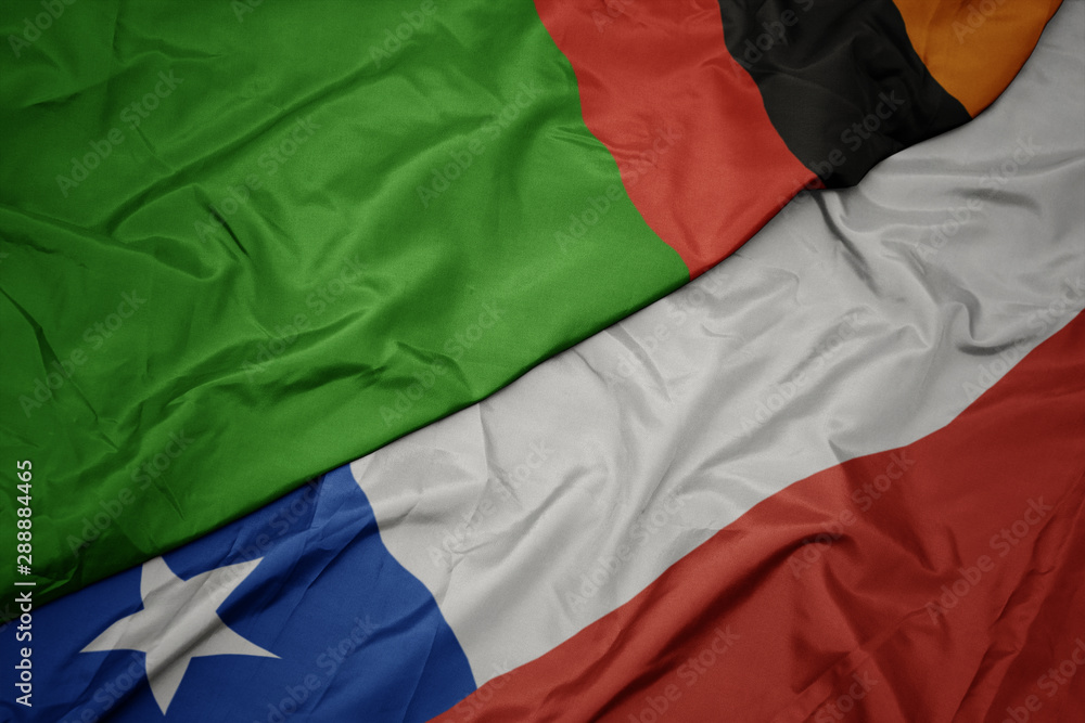 waving colorful flag of chile and national flag of zambia.