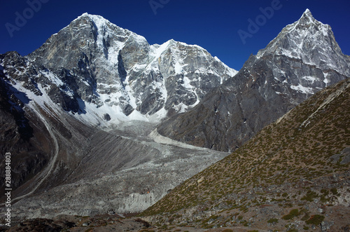 Everest trek, View of Tabuche peak (6367 m), Cholatse (6335 m), Arakam Tse (6423 m) and Chola glacier in Himalayas mountains in the end of may, Sagarmatha national park, Solukhumbu, Nepal photo