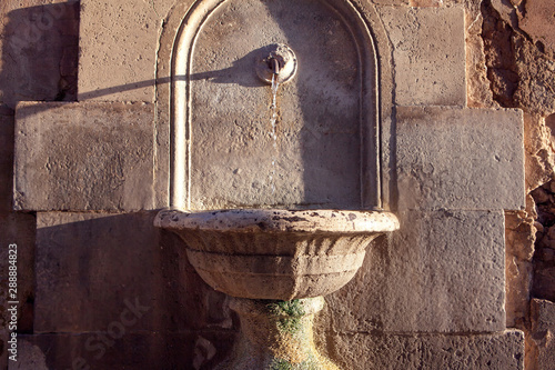 Cuadro en lienzo ancient fountain with cold water for drinking