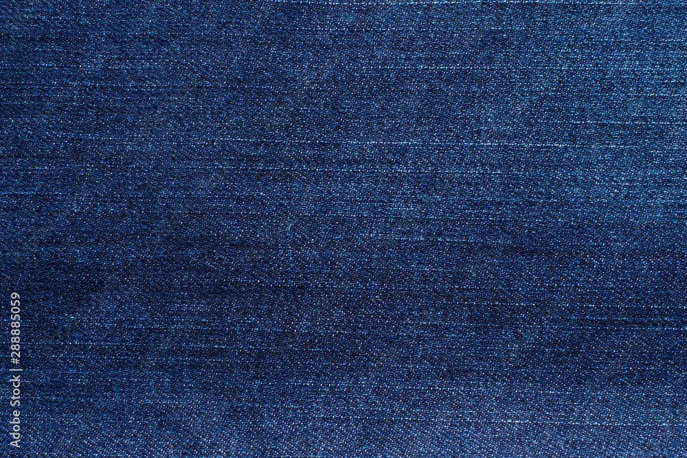 Macro, Close-up of texture details of denim blue jeans. Pattern of fabric or textile is abstract background. Concept design fashion and retro stlye. Macro, Close-up of texture details of denim blue jeans. Pattern of fabric or textile is abstract background. Concept design fashion and retro stlye.