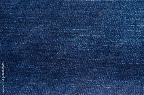 Macro, Close-up of texture details of denim blue jeans. Pattern of fabric or textile is abstract background. Concept design  fashion and retro stlye.