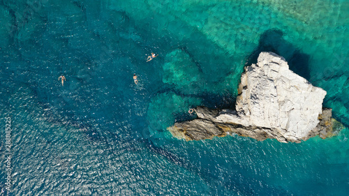 Aerial drone photo of iconic small chapel of Agia Anna built just above emerald rocky pebble beach, Amorgos island, Cyclades, Greece