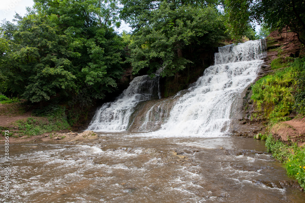 Obraz premium Dzhurinsky waterfall - a waterfall on the river Dzhurin in Zaleschitsky district of Ternopil region of Ukraine.. The height of the waterfall is 16 meters