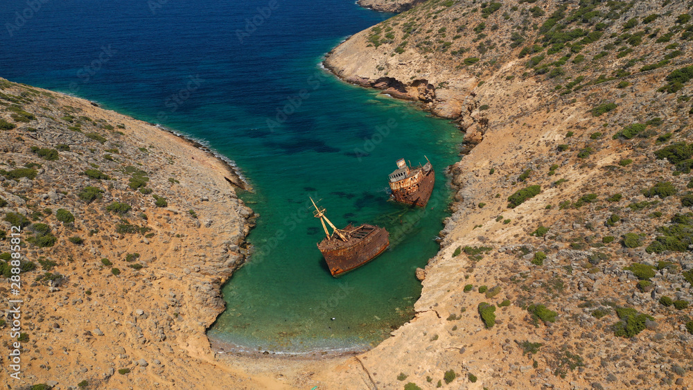 Aerial drone photo of old abandoned rusty shipwreck near area of Kalotaritissa, Amorgos island, Cyclades, Greece