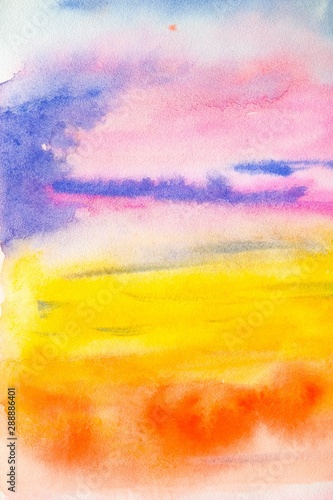 Bright watercolor background with different rainbow colors, resembles a sunset in the sky, the setting sun and multi-colored clouds. Background for design, cards, paper.