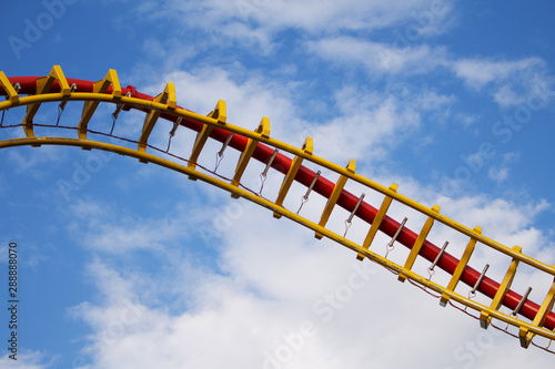 Fototapeta Naklejka Na Ścianę i Meble -  Roller Coaster Ride in Amusement Park. Entertainment and Adventure