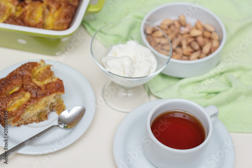 Fig cake, ice cream and a cup of tea