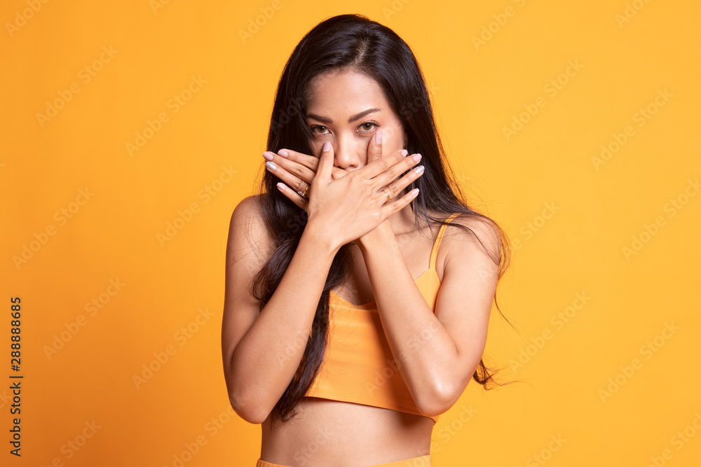 Beautiful young Asian woman close her mouth. Beautiful young Asian woman close her mouth.