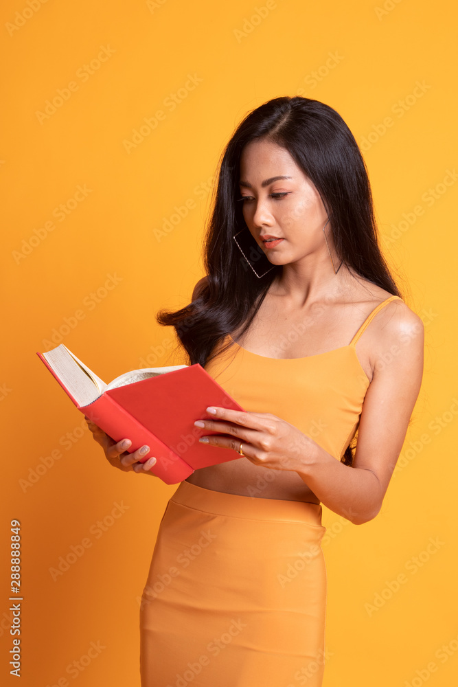 Young Asian woman read a book. Young Asian woman read a book.