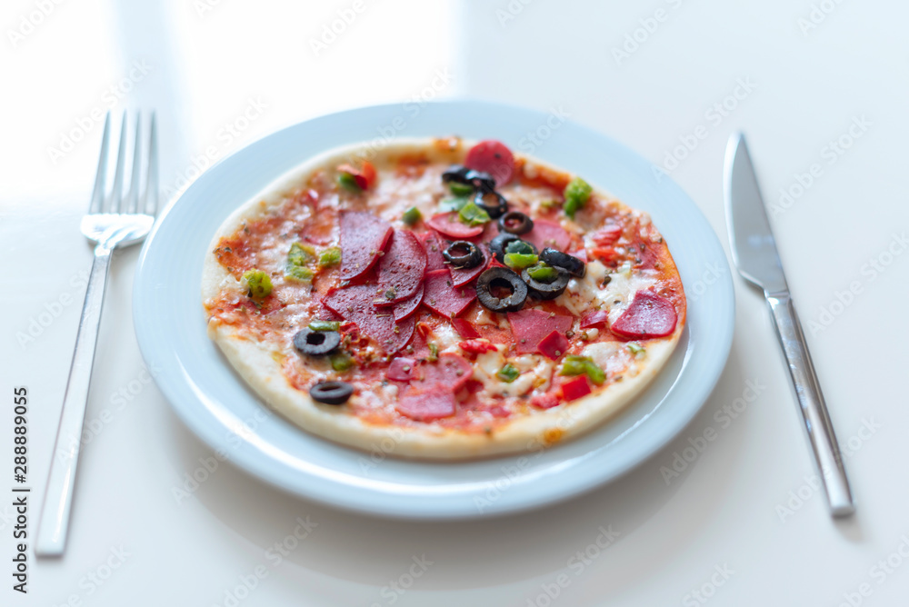 homemade pizza on white plate homemade pizza on white plate