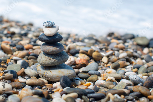 pyramid of stones by the sea. balanced stones.
