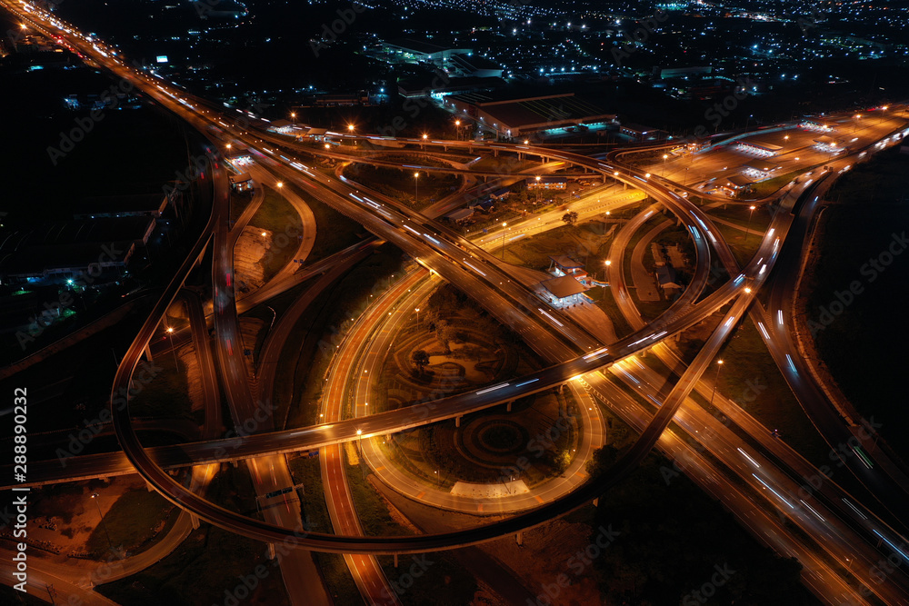 Aerial view. Traffic of expressways, motorways and highways at night.