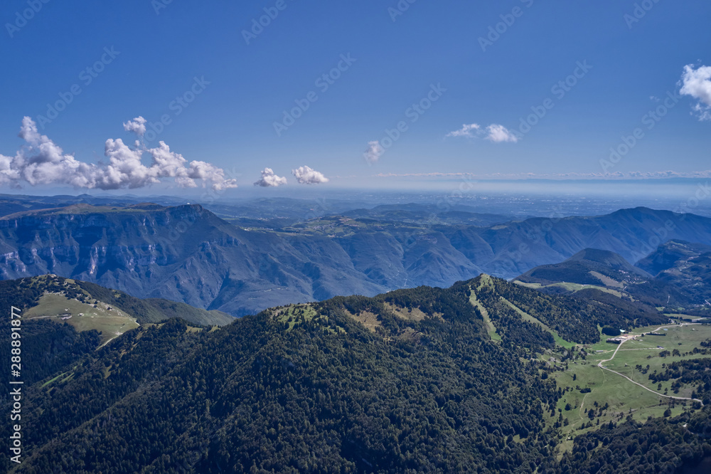 Naklejka premium Aerial photography. Panoramic view of the Alps north of Italy. Trento Region. Great trip to the Alps.