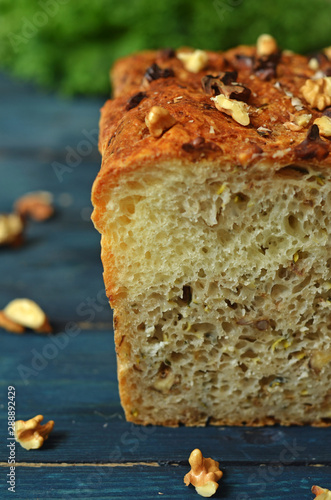 Bread with nuts on a wooden background