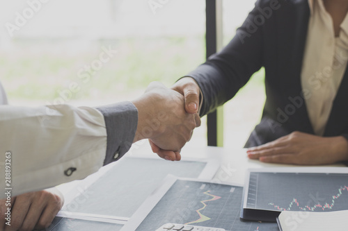 Murais de parede Shake hands of businessmen, young men, the company's financial accountants join