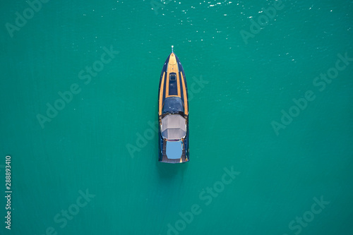 luxury yacht on blue water top view