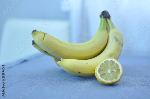 Fruits bananas and half lemon