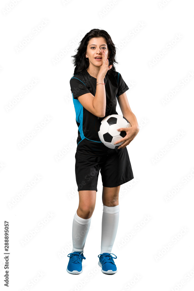 A full-length shot of a Young football player woman whispering something over isolated white background