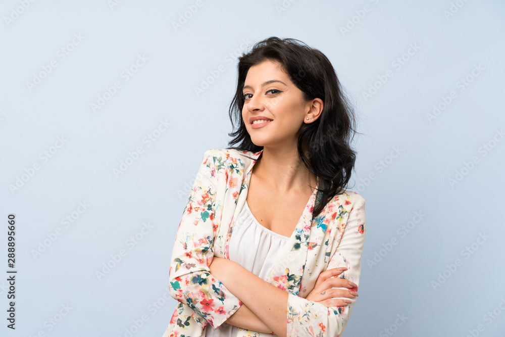 Young woman over isolated blue background laughing Young woman over isolated blue background laughing