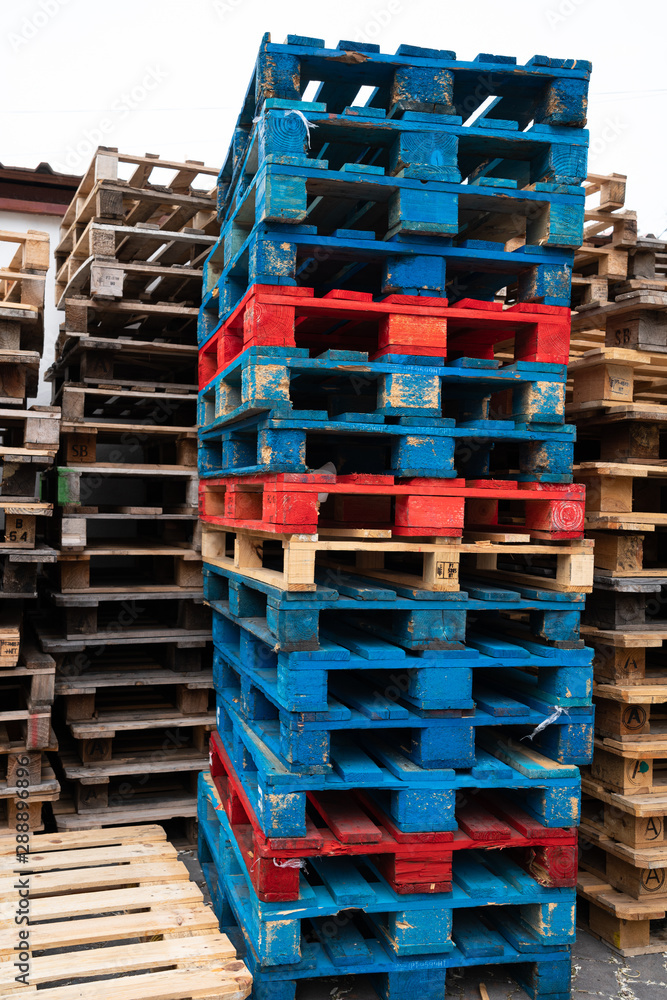 Red and blue colored wooden pallets Stock Photo Adobe Stock