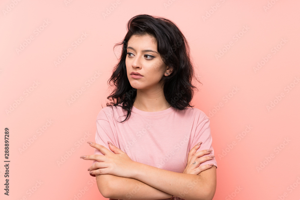 Young woman over isolated pink background thinking an idea Young woman over isolated pink background thinking an idea