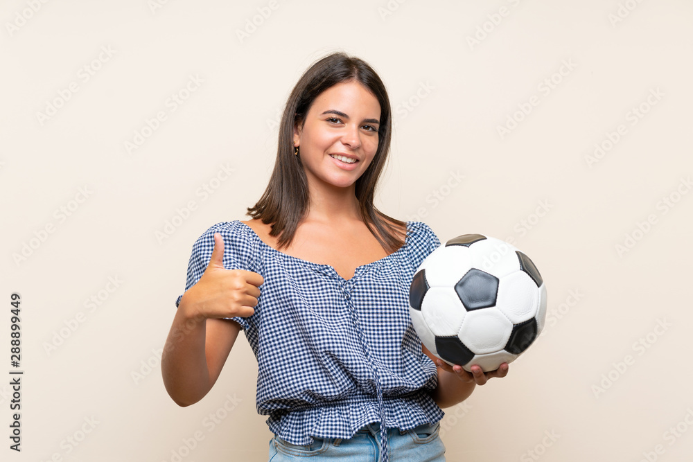 Young girl over isolated background holding a soccer ball Young girl over isolated background holding a soccer ball