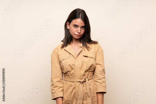 Young girl over isolated background with sad and depressed expression