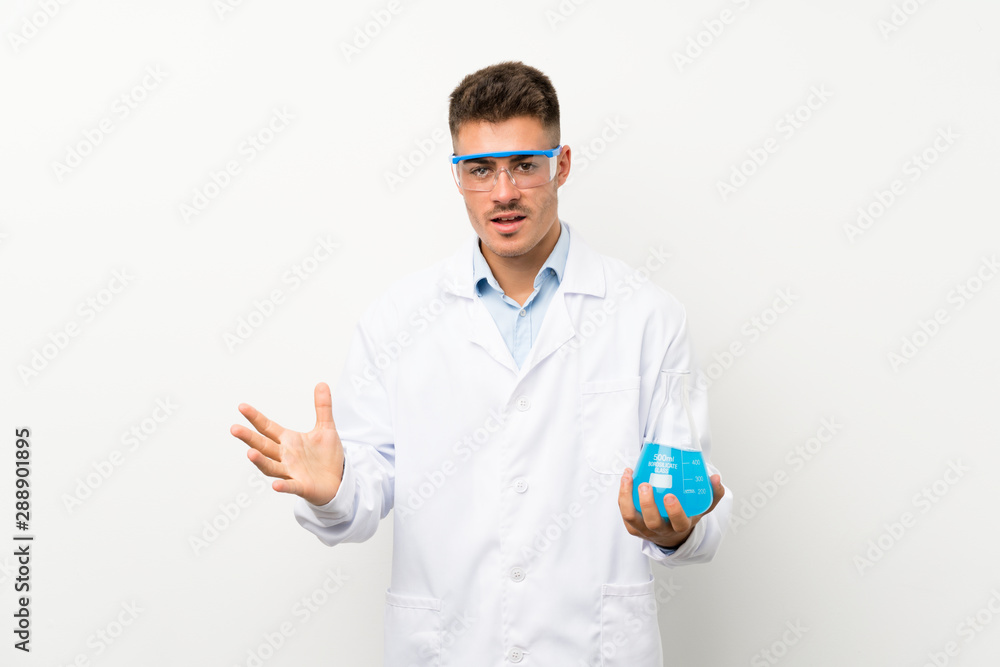 Young scientific holding laboratory flask over isolated background unhappy and frustrated with something Young scientific holding laboratory flask over isolated background unhappy and frustrated with something