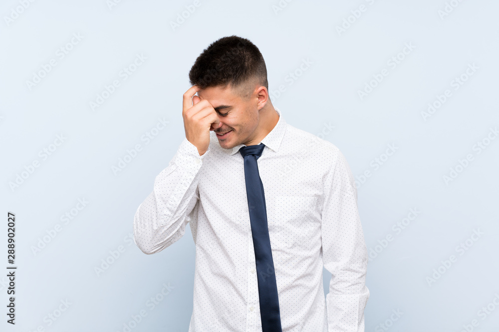 Handsome businessman over isolated blue background laughing Handsome businessman over isolated blue background laughing