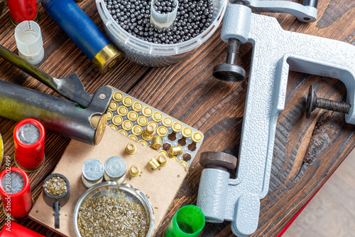 Canvas Print reloading process shotgun shells with special reload equipment