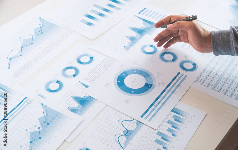 businessman working data document graph chart report marketing research development planning management strategy analysis financial accounting. Business office concept. businessman working data document graph chart report marketing research development planning management strategy analysis financial accounting. Business office concept.