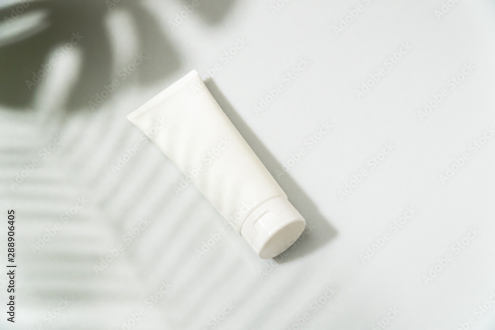 White mock up cleansing face foam on white background with leaf shadow White mock up cleansing face foam on white background with leaf shadow