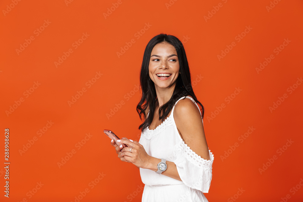 Beautiful young brunette girl wearing white dress standing Beautiful young brunette girl wearing white dress standing