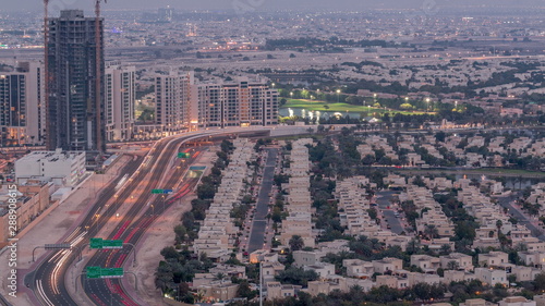Jumeirah Lake Towers residential district aerial day to night timelapse near Dubai Marina