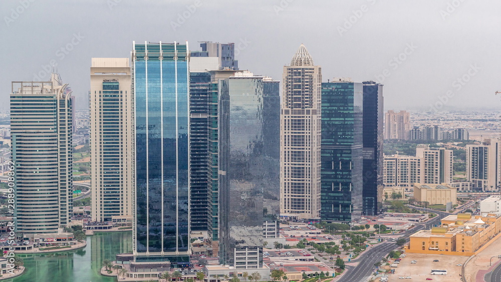 Naklejka premium Jumeirah Lake Towers residential district aerial timelapse near Dubai Marina