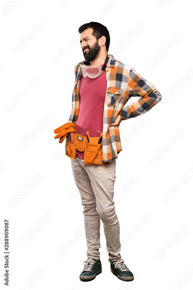 Craftsmen man suffering from backache for having made an effort over isolated white background Craftsmen man suffering from backache for having made an effort over isolated white background